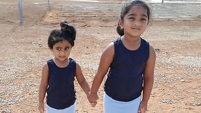 Kopika, 4, and Tharunicaa, 2, inside the Christmas Island Detention Centre.